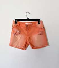 DREAM OUT LOUD distressed orange shorts by Selena Gomez