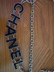 Authentic Chanel gold-tone chain belt featuring black logo letters. Size xs-xl