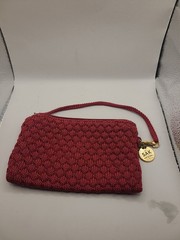 Wristlet Sak in crocheted cabernet color with handle.