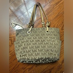 Michael Kors Jet Set tote the brand’s signature monogram canvas & gold hardware